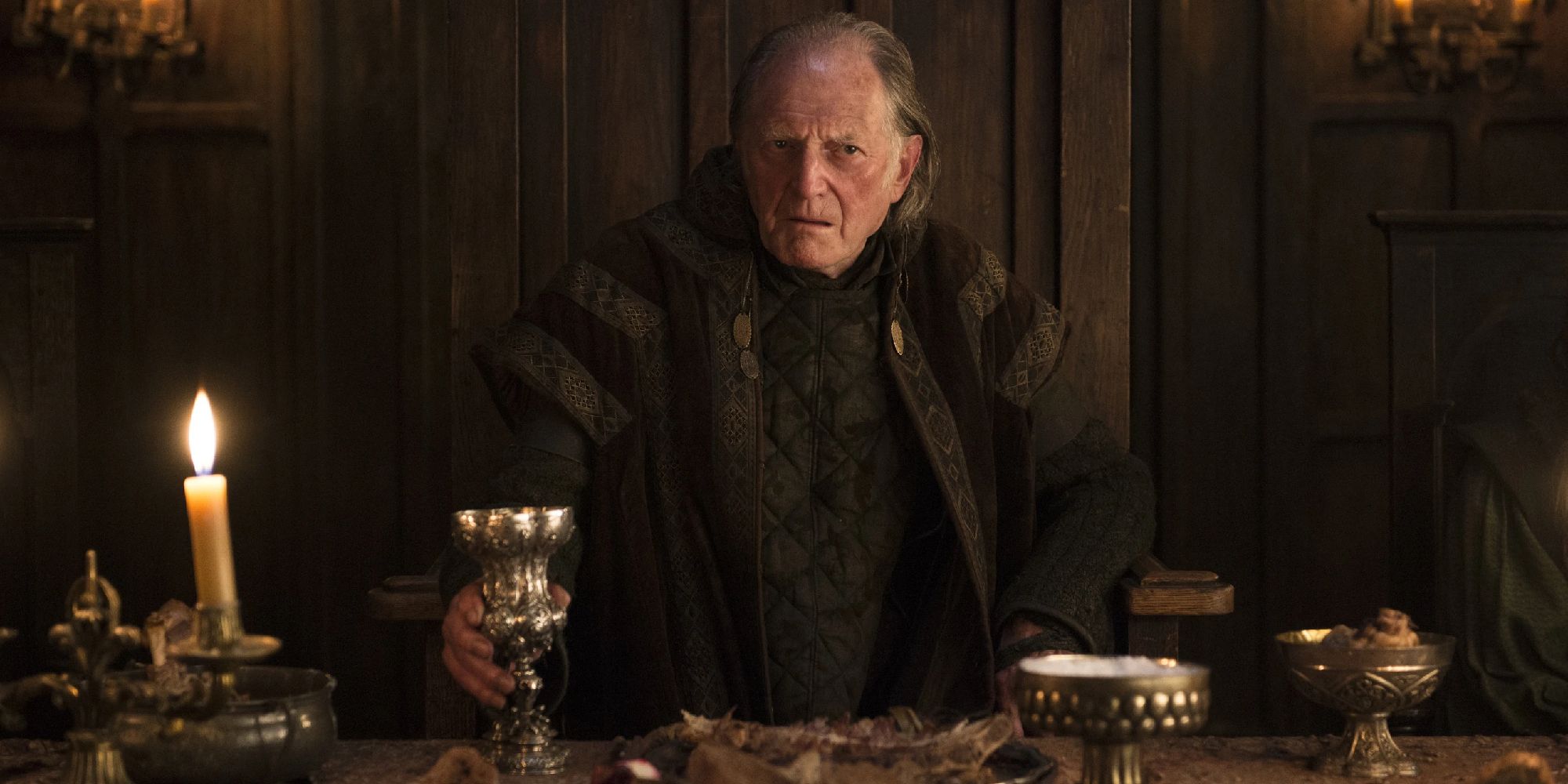 Walder Frey sitting at his high table in HBO's 'Game of Thrones'