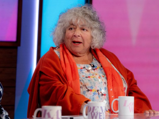 Miriam Margolyes wearing a spotted blouse and orange cardigan during an appearance on Loose Women