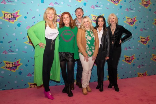 (L-R) Caroline Rhea, Elisa Donovan, Nate Richert, Melissa Joan Hart, Jenna Leigh Green, and Beth Broderick of the TV series Sabrina the Teenage Witch pose for a group photo together on the red carpet at 90s Con on March 18, 2023 