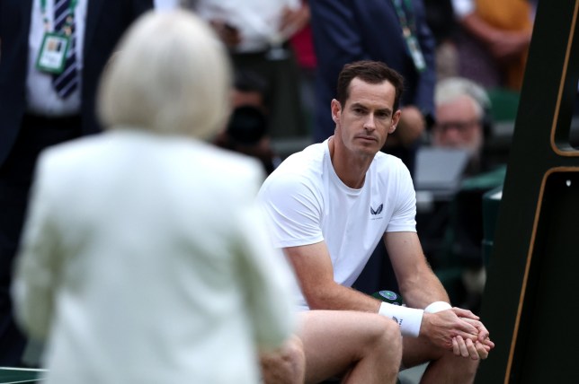 Andy Murray looking at Sue Barker who is walking towards him