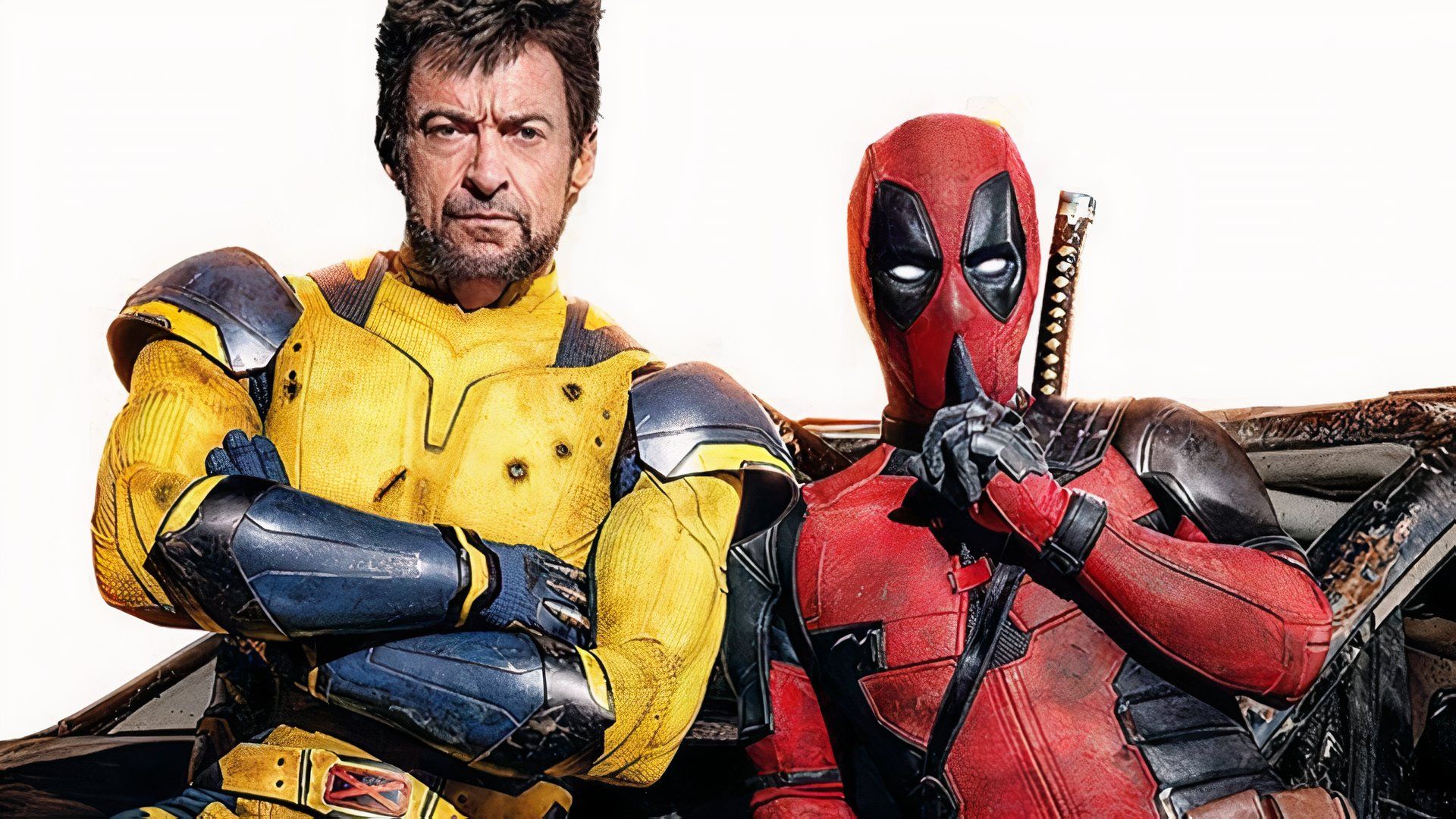 Wolverine with his arms folded and Deadpool shushing.