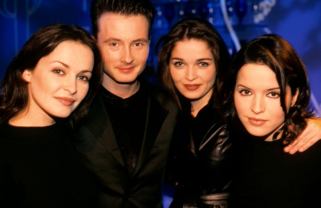 Sharon Corr, Jim Corr, Andrea Corr and Caroline Corr of The Corrs pose for a photo in black outfits in the 1990s
