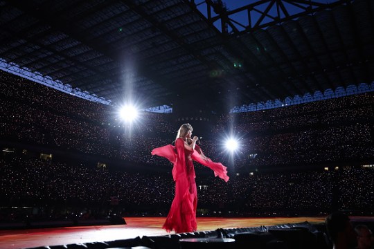 Taylor Swift spins on stage as she sings folklore and evermore eras during Eras Tour