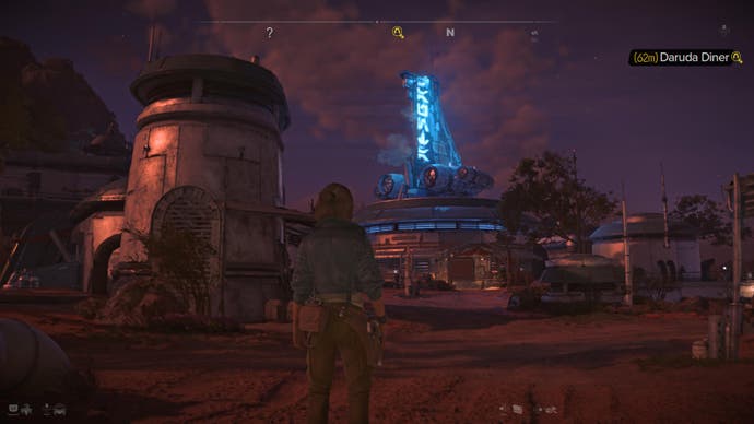 Star Wars Outlaws screenshot showing Kay looking towards the blue neon sign of a canteena at dusk.