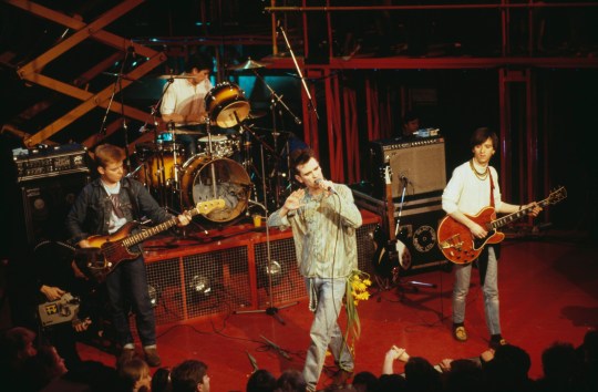 English rock band, The Smiths (L-R; Andy Rourke, Mike Joyce, Morrissey, and Johnny Marr), perform live on stage, 1984