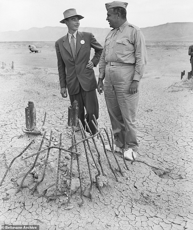 Major General Leslie Groves (right), Chief of Manhattan Engineering District in which the first Atomic Bomb was developed, and Dr. J.R. Oppenheimer, Director of top secret project discussing the secret program that led to the plutonium pollution still present on site today