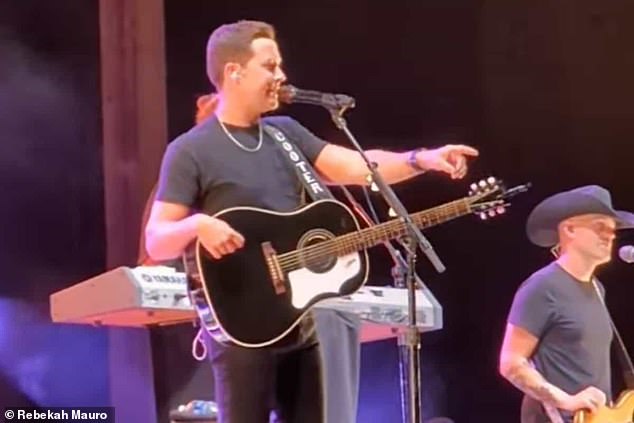 Country singer Scotty McCreery interrupted his show to kick out a man who allegedly struck a woman in the audience