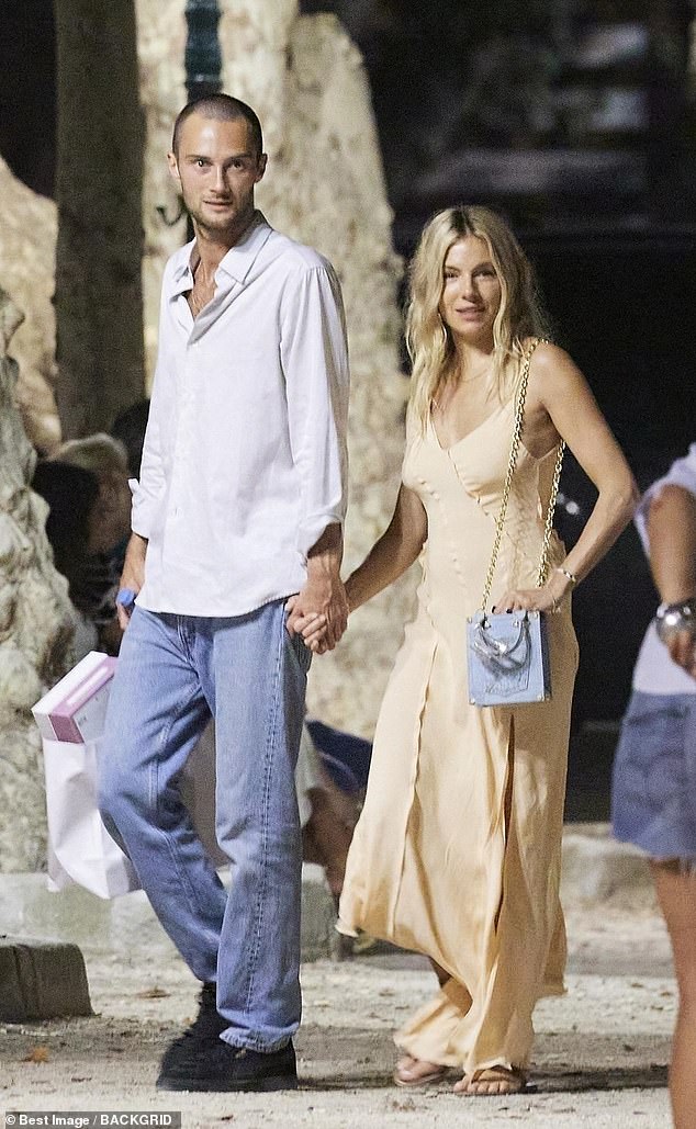 Sienna Miller looked loved-up on Wednesday as she went for a romantic stroll in Saint-Tropez with her boyfriend Oli Green, who sported a dramatic new look