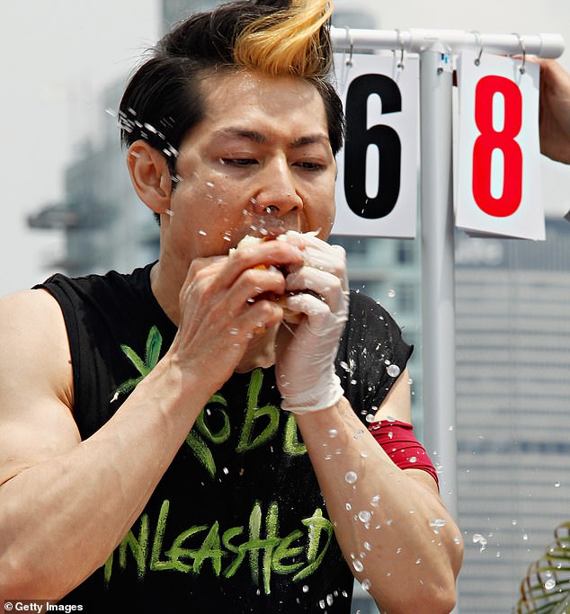 Takeru Kobayashi uses the 'Solomon method' which involves tearing hotdogs in half before dunking them in water