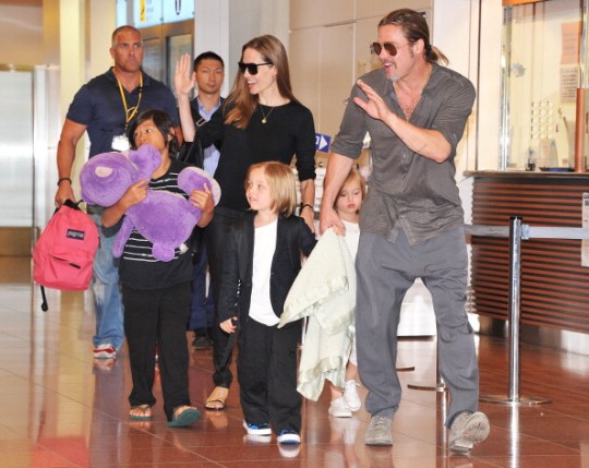 Angelina Jolie And Brad Pitt with their children in an airport