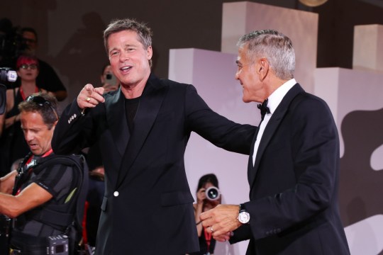 Brad Pitt and George Clooney pose on the red carpet