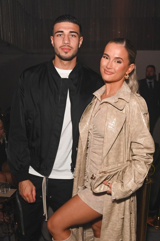 Tommy Fury and Molly-Mae Hague standing next to each other at an event