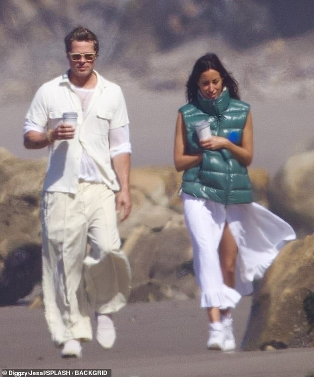 Brad Pitt and his girlfriend Ines de Ramon enjoyed a romantic morning stroll on the beach in May