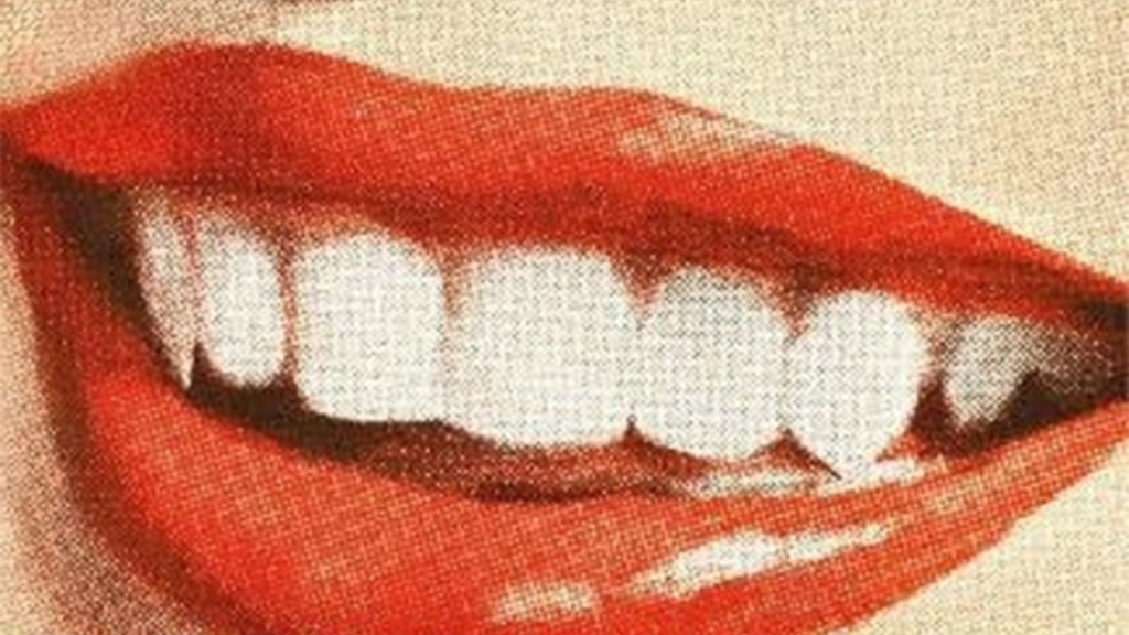 A close-up illustration of a red-lipped mouth with extended canine teeth from the cover of Nightbitch by Rachel Yoder