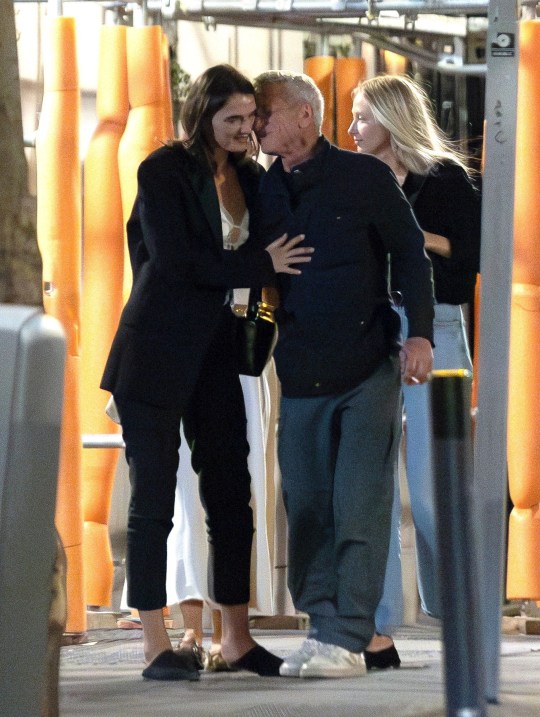 Sean Penn whispers to new girlfriend Valeria Nicov 