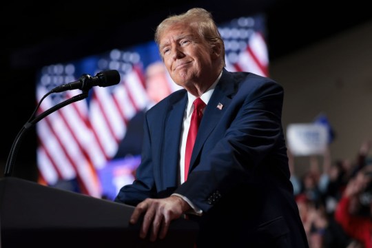 Donald Trump in front of microphone 