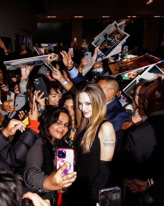 Angelina Jolie taking selfies on the red carpet