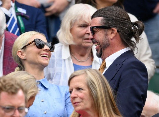 Dave Grohl and Jordyn Blum laughing in Wimbledon 2024 crowd 