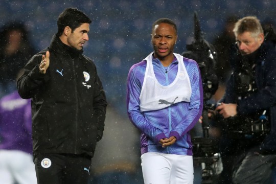 Mikel Arteta assistant coach of Manchester City speaks to Raheem Sterling during the Carabao Cup Quarter Final match between Oxford United and Manchester City 