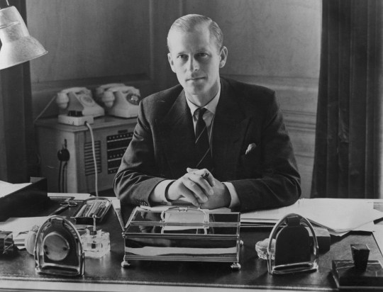 Prince Philip, Duke of Edinburgh, sitting at his desk at Clarence House, 10th August 1951. (Photo by Fox Photos/Hulton Archive/Getty Images)