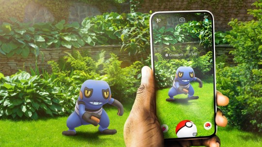 Pokémon Go being played in a garden.