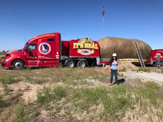 The Big Idaho Potato Hotel being carried on a red lorry that reads 'It's real'