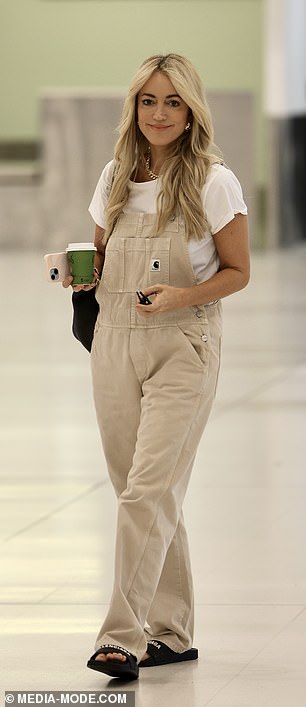 She added a designer touch to her chic ensemble with a pair of luxury Balenciaga black sandals