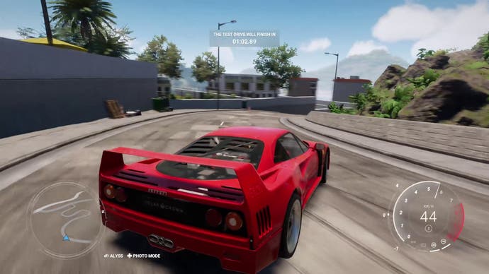 Test Drive Unlimited Solar Crown screenshot showing a test drive of a Ferrari F40, which is drifting around a hairpin.