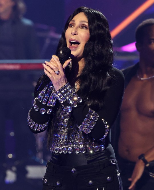 Cher singing on stage