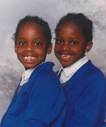 Kim Kinloch and her twin sister in a school photo as children wearing school uniform