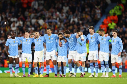 Manchester City players line up together during a penalty shootout in the Champions League