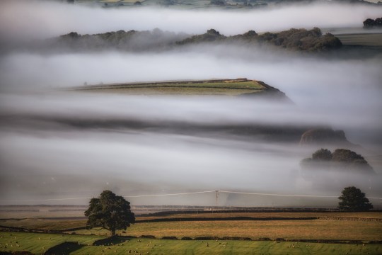 Morning mist on Tuesday (17 Sep) near Tideswell, in the Peak District of Derbyshire. The photographer, known as Villager Jim, also captured the moment a mysterious 'flying angel' formed over countryside skies in the Peak District.