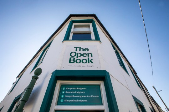 Open Book in Wigtown, Galloway, which can be booked along with it's apartment above and run as a bookshop via AirBnB. Friends Daisy Yeung and Lydia Man from Hong Kong are currently staying in the property and running the bookshop for a week. Photo released September 18 2024. Welcome to the world's only book shop Airbnb where guests spend the night - and run the store in the day.The Open Book a charming bookshop with a flat above so people can sleep upstairs and sell books downstairs.Based in Wigtown - Scotland's National Book Town - it gives book lovers the chance to ''live their dream'' of having their very own shop by the sea.Airbnb say it is ''the first ever bookshop holiday residency experience'' - and is so popular it has a two year waiting list from guests around the globe.