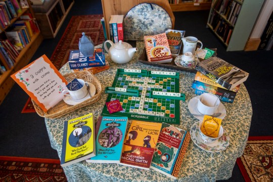 Open Book in Wigtown, Galloway, which can be booked along with it's apartment above and run as a bookshop via AirBnB. Friends Daisy Yeung and Lydia Man from Hong Kong are currently staying in the property and running the bookshop for a week. Photo released September 18 2024. Welcome to the world's only book shop Airbnb where guests spend the night - and run the store in the day.The Open Book a charming bookshop with a flat above so people can sleep upstairs and sell books downstairs.Based in Wigtown - Scotland's National Book Town - it gives book lovers the chance to ''live their dream'' of having their very own shop by the sea.Airbnb say it is ''the first ever bookshop holiday residency experience'' - and is so popular it has a two year waiting list from guests around the globe.