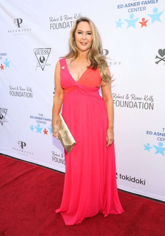 Bewitched actress Erin Murphy in a pink dress on a red carpet 