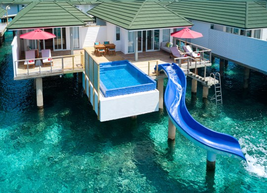 Every overwater villa comes equipped with its own water slide