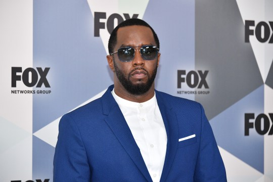 Sean 'Diddy' Combs in 2018, dressed in a blue blazer and sunglasses