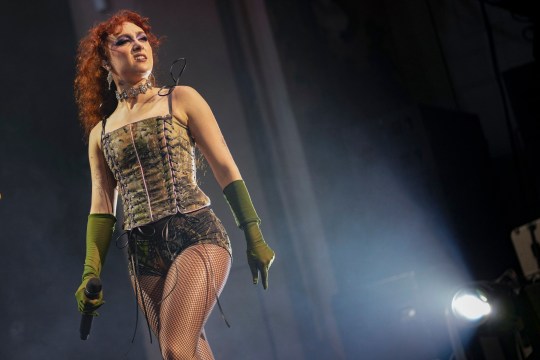 Chappell Roan wearing a corset, shorts and green gloves on-stage at London's Brixton Academy