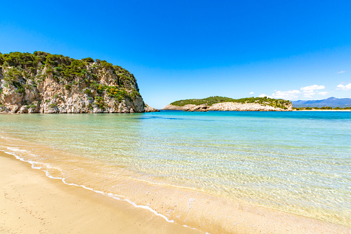 Voidokilia Beach, popular white sand and blue clear water beach in Messinia in Mediterranean area in shape of Greek letter omega, Peloponnese, Greece.