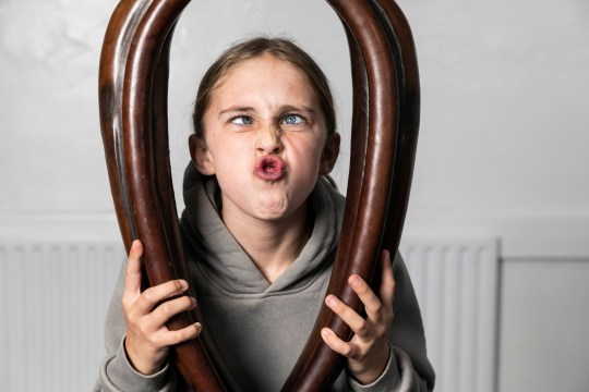 Kendal Lister, 10, from Cumbria. Duaghter of Claire who is the woman's champion. Competitors compete in the World Gurning Championships 2024, in Cumbria. The World Gurning Chamionship is part of the Egremont Crab Fair, which first started in 1297, pictured in Cumbria,Sep 21 2024. Gurning is described as pulling a grotesque face. A typical gurn involves pushing the lower jaw as far forward and up as possible, and covering the upper lip with the lower lip. Competitors must wear a large horse collar at the same time as gurning - but the rules are generally accepted to stop there.