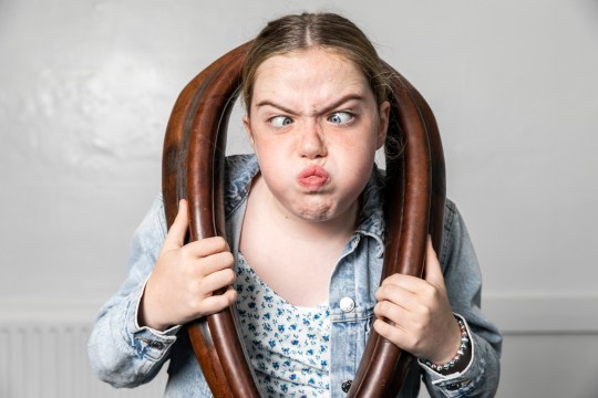 Indie Irwin, 12, grandaughter of the 19 time World Gurning champion Tommy Mattinson. Competitors compete in the World Gurning Championships 2024, in Cumbria. The World Gurning Chamionship is part of the Egremont Crab Fair, which first started in 1297, pictured in Cumbria,Sep 21 2024. Gurning is described as pulling a grotesque face. A typical gurn involves pushing the lower jaw as far forward and up as possible, and covering the upper lip with the lower lip. Competitors must wear a large horse collar at the same time as gurning - but the rules are generally accepted to stop there.