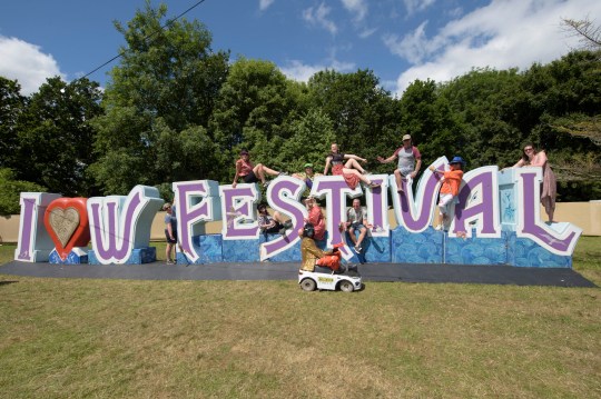 Festival goers enjoying the sun at the Isle Of Wight Festival 2024