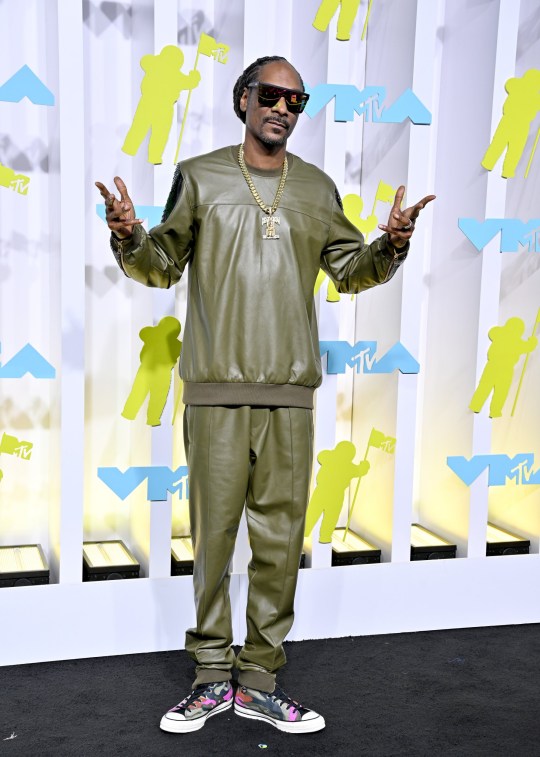 Snoop Dogg in a matching green two-piece