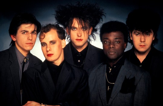 The Cure posing for photo including Phil Thornalley, Porl Thompson, Robert Smith, Andy Anderson and Lol Tolhurst 