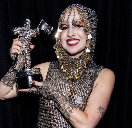 Chappell Roan poses with her award at the MTV VMAs