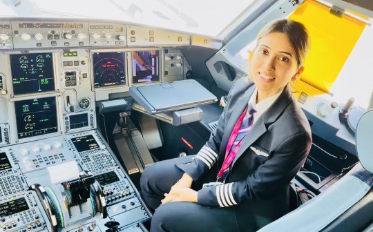 Shibani in the flight deck of a plane