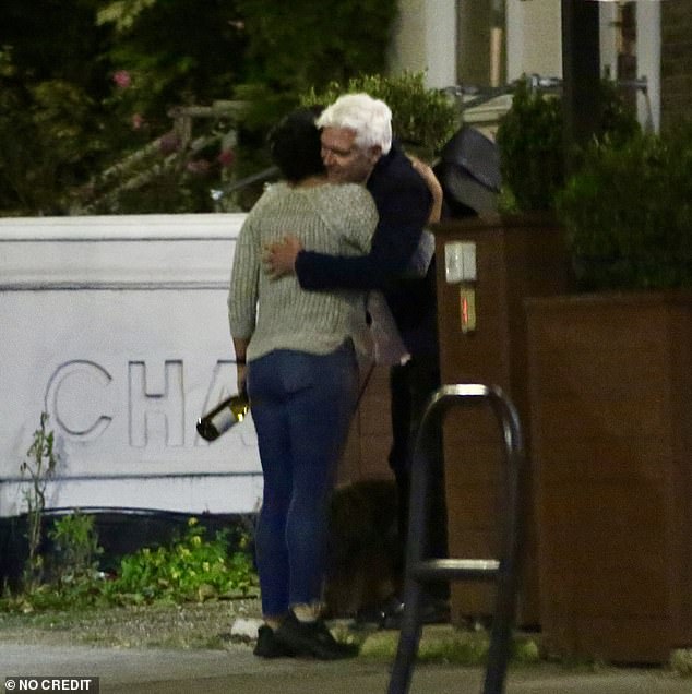 The former ITV star later left the pub, but not before sharing a goodbye hug with a pal, before hopping into a waiting taxi