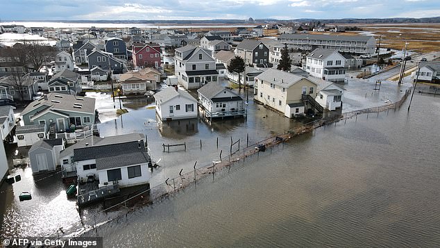 Natural disaster statistics have revealed that severe storms and tornadoes are occurring with more frequency and more intensity due to climate change. Pictured: Coastal flooding in Hampton, New Hampshire this past January in early 2024