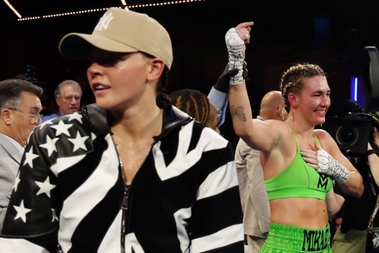 Mikaela Mayer (green trunks) reacts after defeating Sandy Ryan of England (black trunks) by majority decision during their WBO Welterweight title bout at The Theater at Madison Square Garden