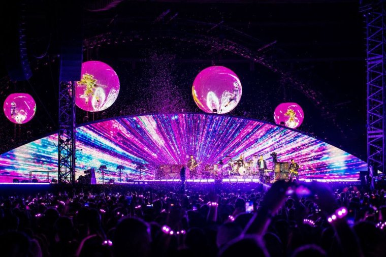 British rock band Coldplay performs on stage during a concert at the Ernst Happel Stadium in Vienna, Austria on August 21, 2024. Security measures have been tightened in Vienna for a series of concerts by British band Coldplay this week, Austrian police said on August 20, 2024, after Taylor Swift's shows were cancelled after a suicide bombing plot. (Photo by TOBIAS STEINMAURER / APA / AFP) / Austria OUT / RESTRICTED TO EDITORIAL USE - MANDATORY MENTION OF THE ARTIST UPON PUBLICATION - TO ILLUSTRATE THE EVENT AS SPECIFIED IN THE CAPTION - NO MARKETING NO ADVERTISING CAMPAIGNS - DISTRIBUTED AS A SERVICE TO CLIENTS - NO ARCHIVE / SOUTH TYROL OUT (Photo by TOBIAS STEINMAURER/APA/AFP via Getty Images)